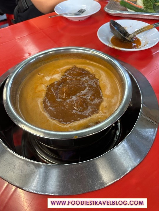 Satay Celup broth in McQuek Satay Celup, Melaka